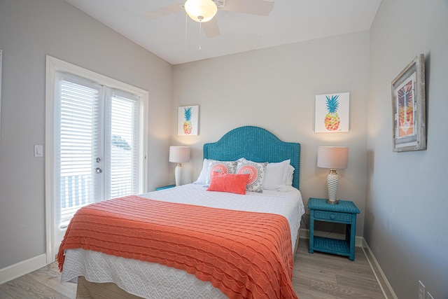 bedroom with ceiling fan, baseboards, wood finished floors, and access to exterior