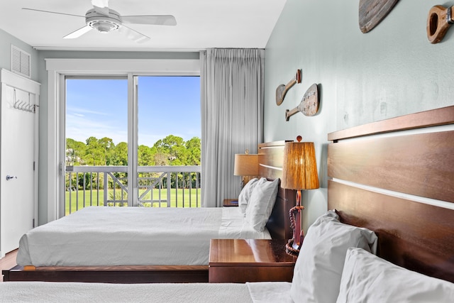 bedroom with access to exterior, hardwood / wood-style floors, and ceiling fan