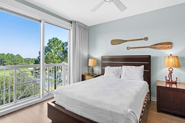 bedroom with wood-type flooring, access to exterior, and ceiling fan