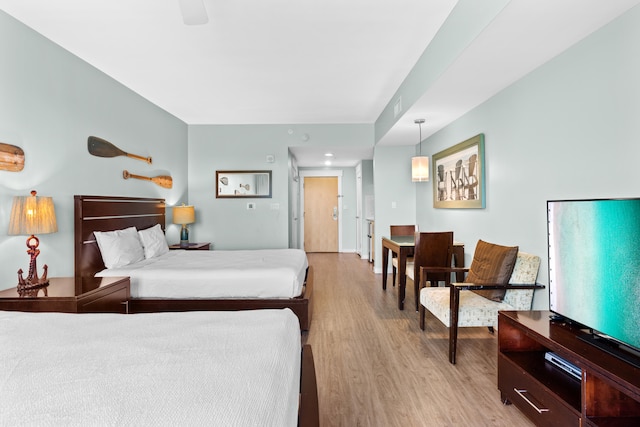 bedroom featuring ceiling fan and light hardwood / wood-style floors