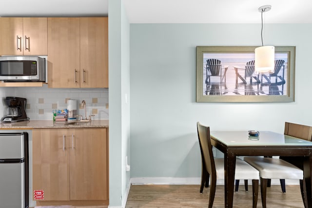 interior space featuring hardwood / wood-style flooring and sink