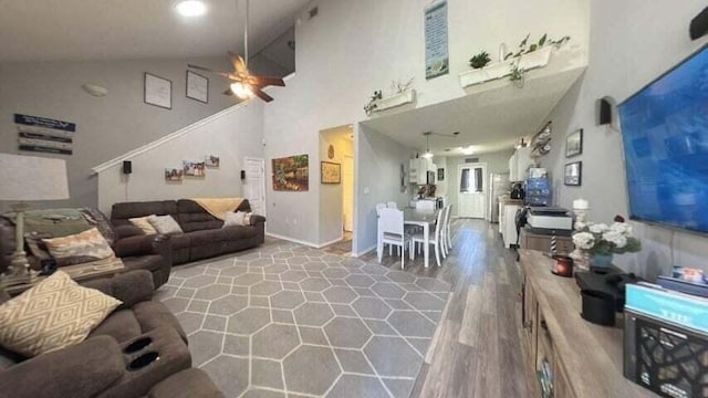 living room with high vaulted ceiling, ceiling fan, and wood-type flooring