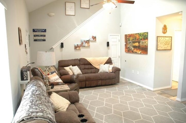 living room featuring high vaulted ceiling, ceiling fan, and hardwood / wood-style floors