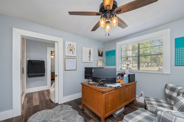 office area with dark wood-type flooring and ceiling fan