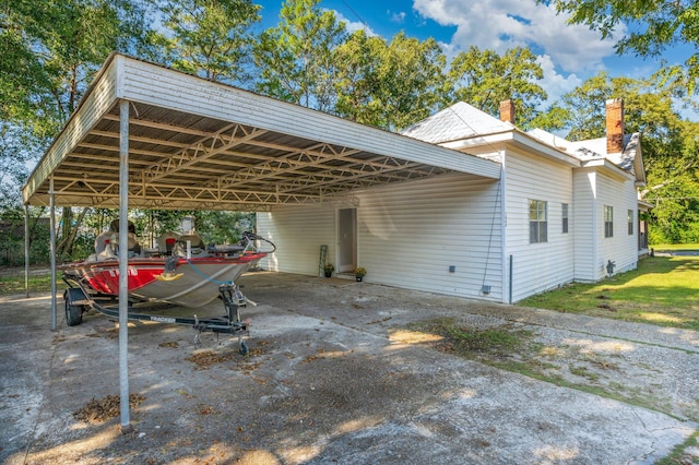 view of vehicle parking featuring a carport