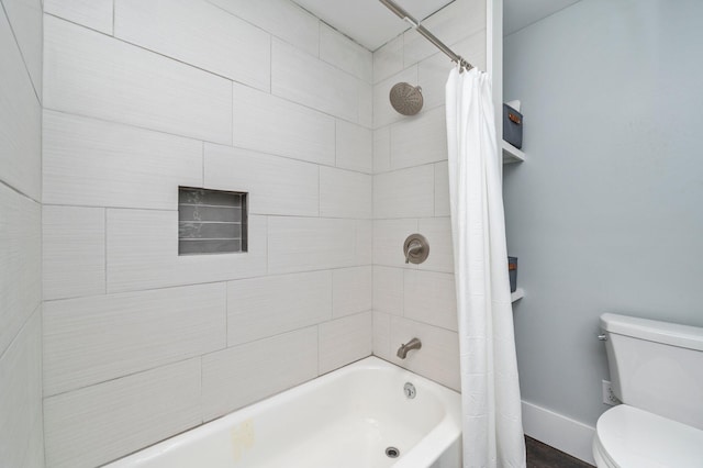 bathroom with shower / bathtub combination with curtain and toilet