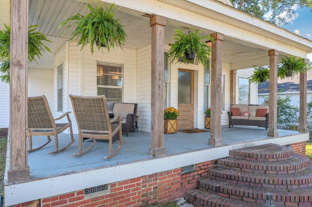 wooden deck featuring outdoor lounge area and covered porch