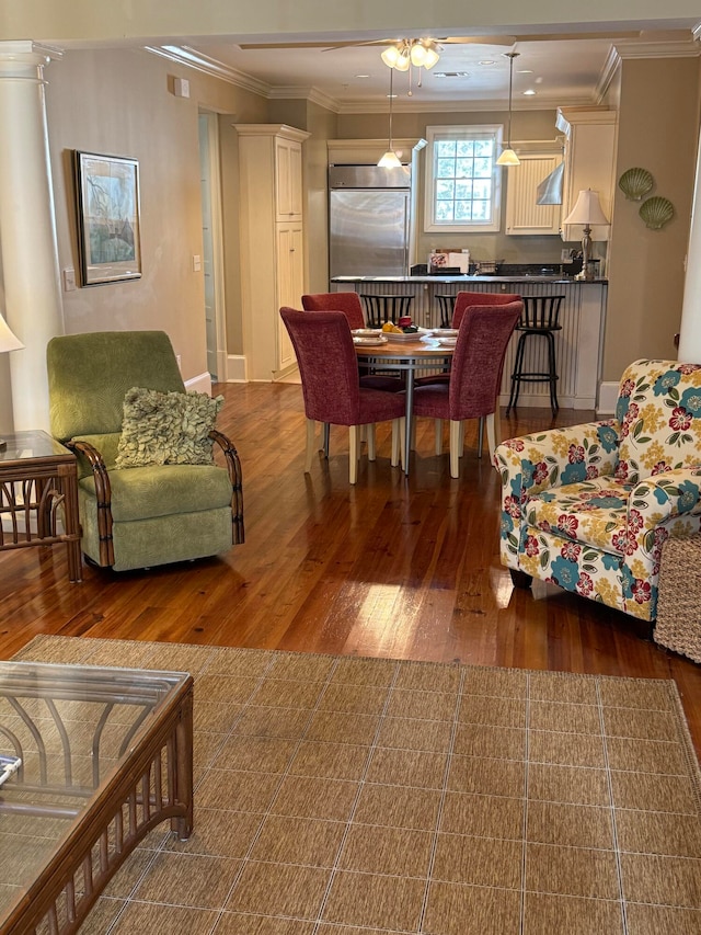 living room featuring crown molding and dark hardwood / wood-style flooring