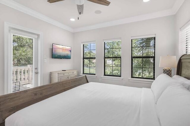 bedroom featuring ornamental molding, multiple windows, and ceiling fan