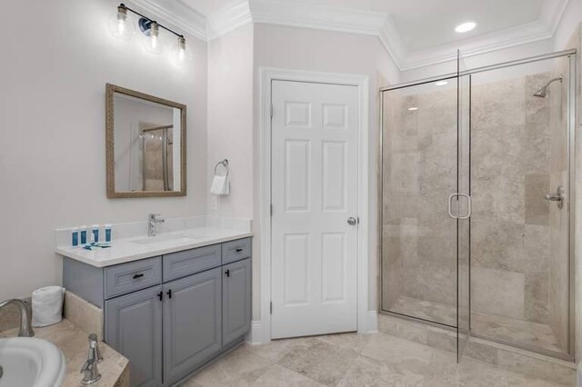 bathroom with ornamental molding, vanity, and walk in shower