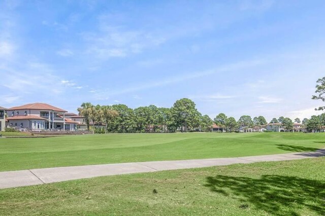 view of property's community with a yard