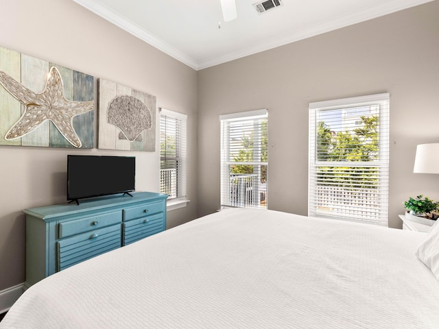 bedroom with multiple windows, crown molding, and ceiling fan