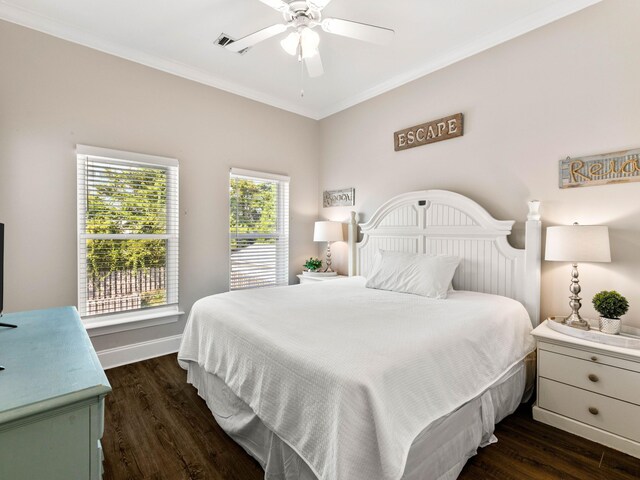 bedroom with dark wood-type flooring, ceiling fan, and ornamental molding