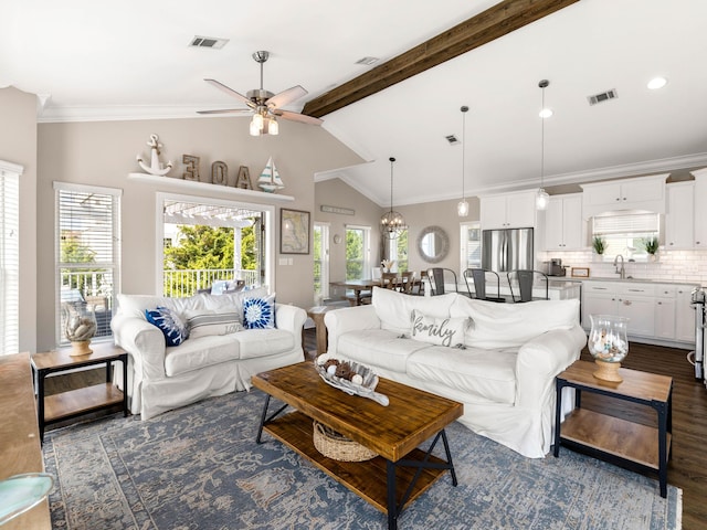 living room with dark wood-type flooring, ceiling fan, lofted ceiling with beams, and sink