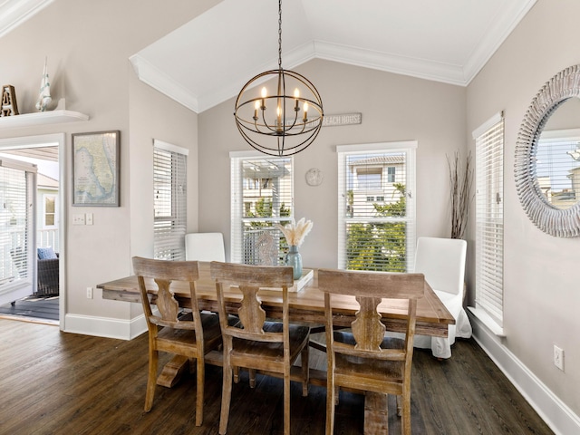 dining space featuring crown molding, dark wood-type flooring, vaulted ceiling, and a wealth of natural light