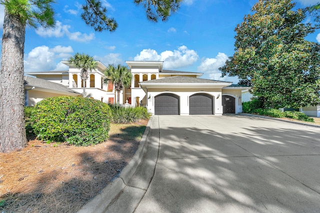 5378 Pine Ridge Ln Unit 5378, Miramar Beach, FL 32550 - mediterranean / spanish-style home featuring a garage, stucco siding, and driveway