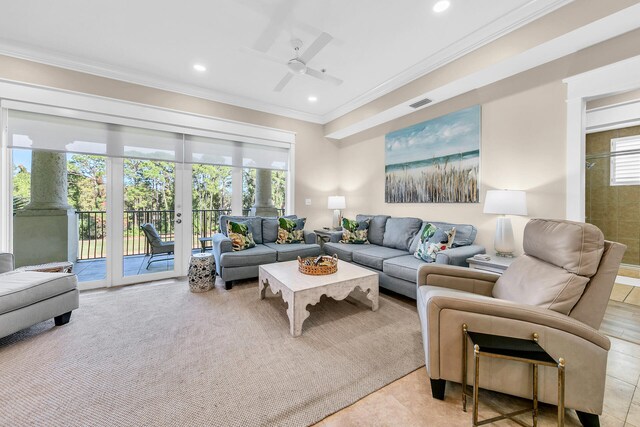 tiled living room with crown molding, french doors, plenty of natural light, and ceiling fan