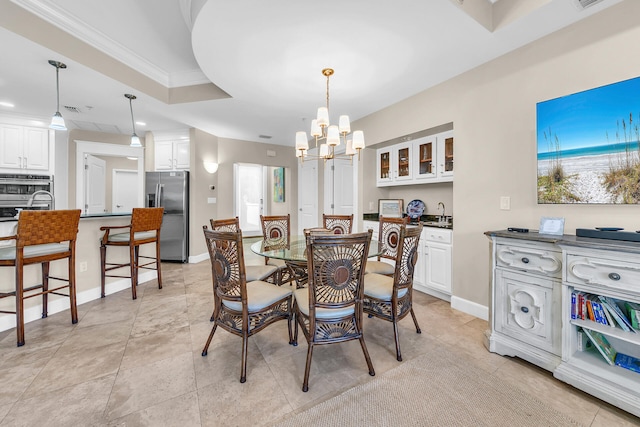 dining space with crown molding, a notable chandelier, and light tile patterned floors