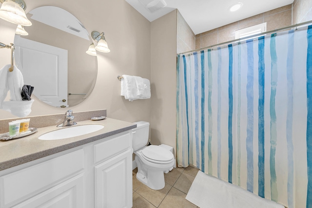 bathroom featuring vanity, toilet, curtained shower, and tile patterned flooring