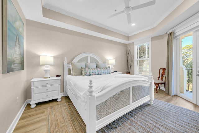 5378 Pine Ridge Ln Unit 5378, Miramar Beach, FL 32550 - bedroom with access to exterior, multiple windows, a tray ceiling, ornamental molding, and recessed lighting