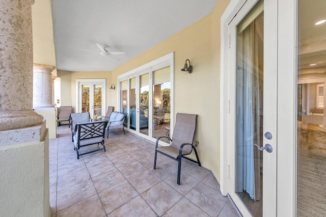 view of patio featuring french doors and ceiling fan