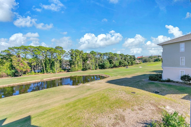5378 Pine Ridge Ln Unit 5378, Miramar Beach, FL 32550 - view of green lawn featuring golf course view, a water view, and view of wooded area