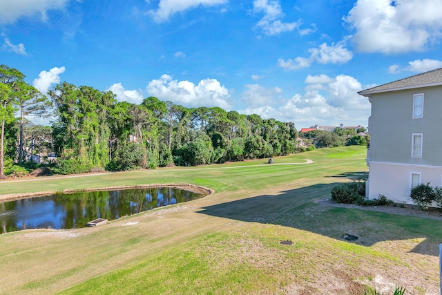 surrounding community featuring a yard and a water view