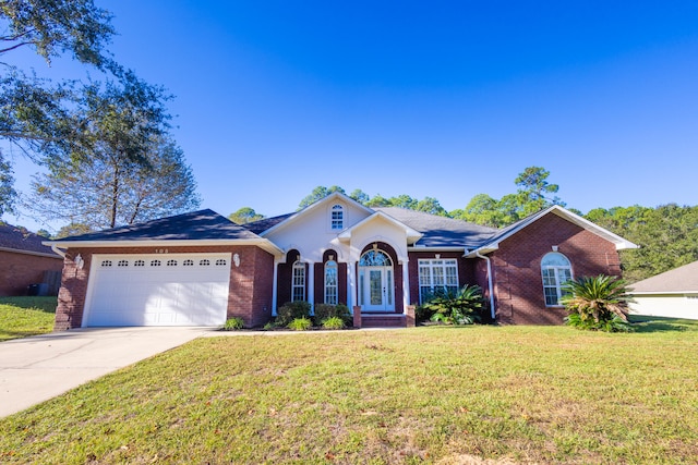 single story home with a front yard and a garage