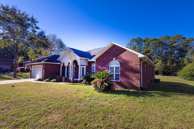 single story home with a front yard, a garage, and central AC