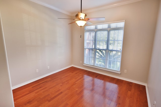 empty room with crown molding, ceiling fan, and hardwood / wood-style floors