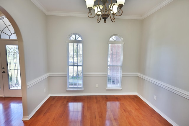 interior space featuring a chandelier, crown molding, and hardwood / wood-style flooring