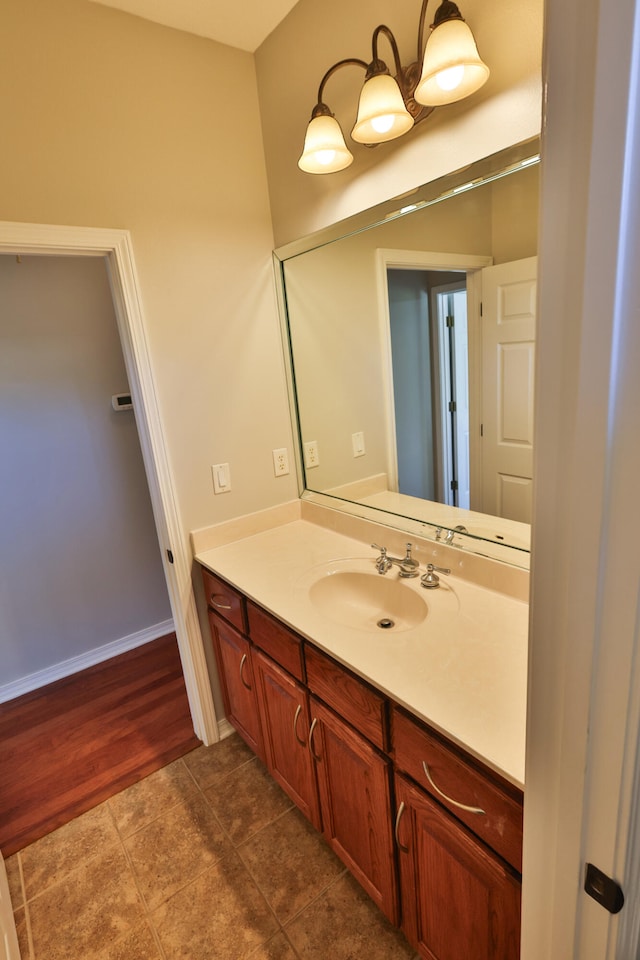 bathroom featuring wood-type flooring and vanity