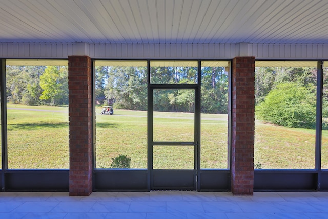 unfurnished sunroom featuring plenty of natural light