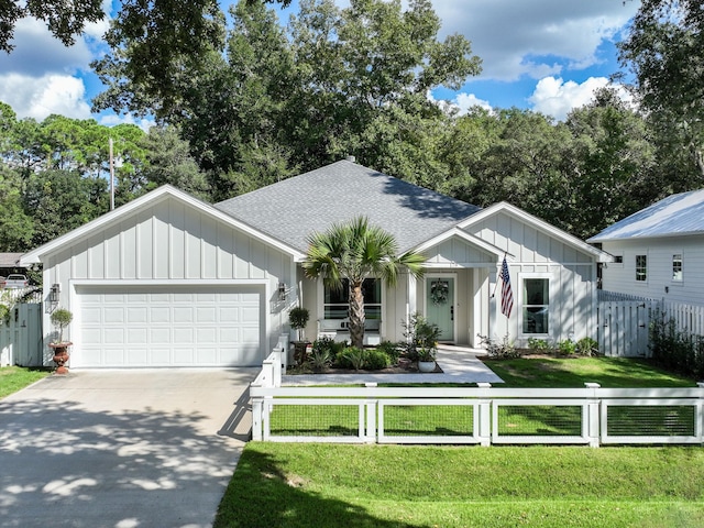 view of front facade with a front lawn and a garage