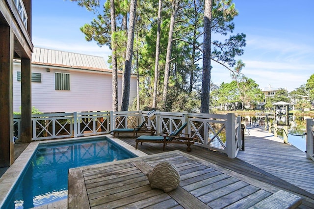 view of pool with a water view