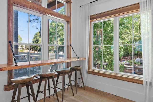 sunroom / solarium featuring a healthy amount of sunlight