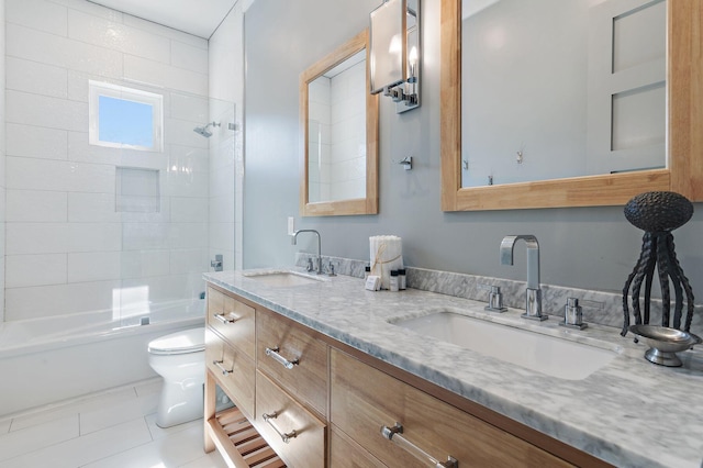 full bathroom with toilet, tiled shower / bath combo, vanity, and tile patterned flooring