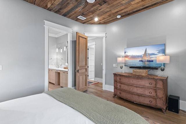 bedroom with ensuite bath, wood ceiling, and hardwood / wood-style floors