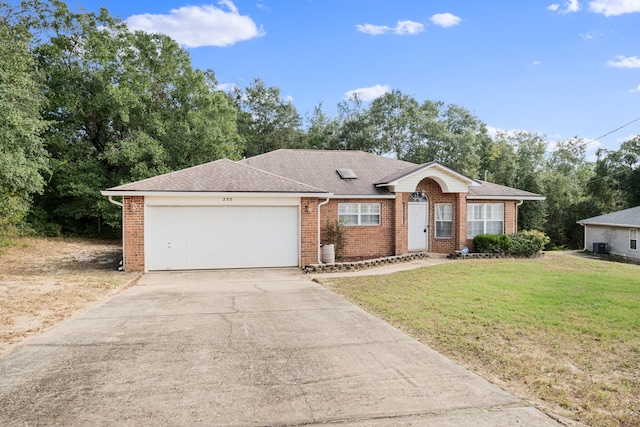 ranch-style home with a front lawn and a garage