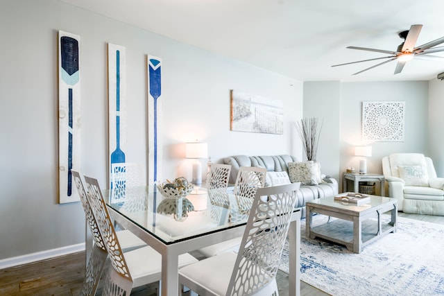 living room with ceiling fan and hardwood / wood-style flooring