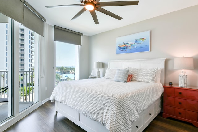 bedroom featuring dark wood-type flooring, access to exterior, and ceiling fan