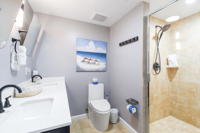 bathroom with walk in shower, vanity, toilet, and tile patterned floors