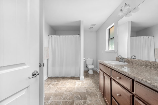 bathroom with vanity, toilet, and a shower with curtain