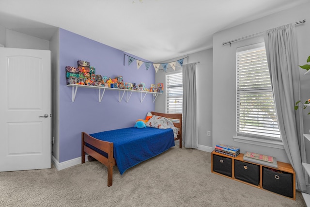 carpeted bedroom with baseboards
