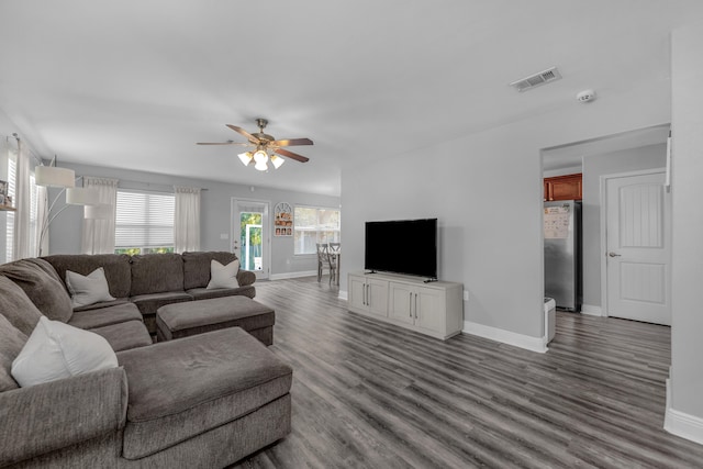 living room featuring light hardwood / wood-style floors and ceiling fan