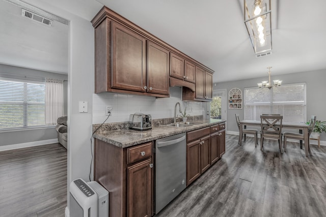 kitchen with dishwasher, backsplash, sink, and dark hardwood / wood-style flooring