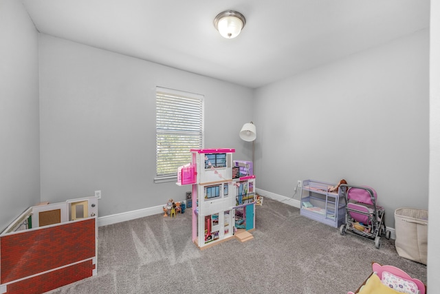 game room with carpet and baseboards
