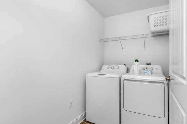 clothes washing area with washer and dryer