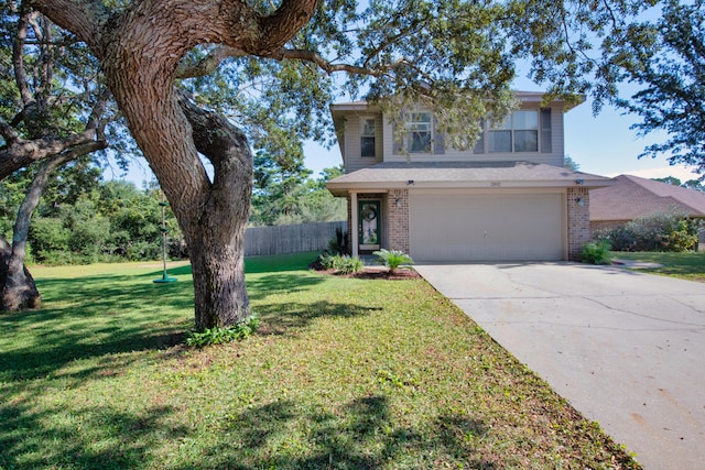 view of front property featuring a front yard and a garage