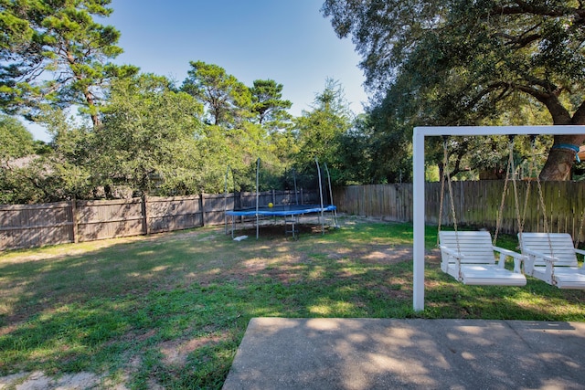 view of yard with a trampoline